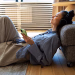 young-woman-with-messy-bun-listening-music_23-2149489045